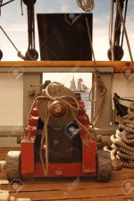 7060229-Looking-through-the-open-gun-port-on-a-vntage-sailing-ship-and-seeing-another-ship-in-...jpg