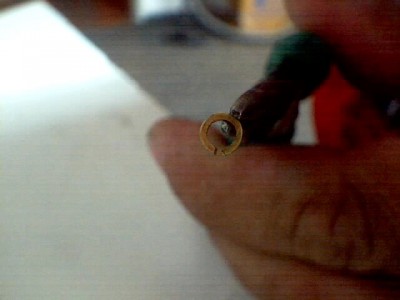 el eslabon abierto lo tomo con una pinza de punta de las usadas en electronica y los cierro por el diametro